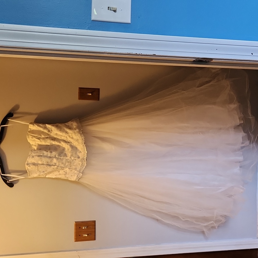 Strapless 2 piece white gown with silver laced top. Fully lined. Size 11